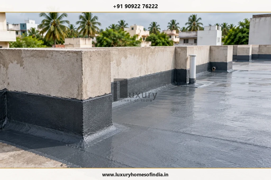 Terrace waterproofing membrane with parapet flashing and rainwater downpipe outlet in Chennai